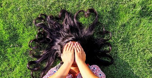 Woman hand on grass