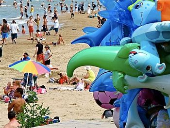 People relaxing on beach