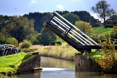 Footbridge over river in park