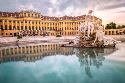 Statue of fountain in front of building