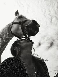 Low angle view of woman against sky