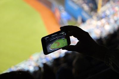 Close-up of hand holding smart phone