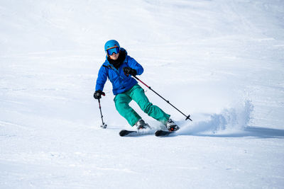 Full length of man skiing on snow