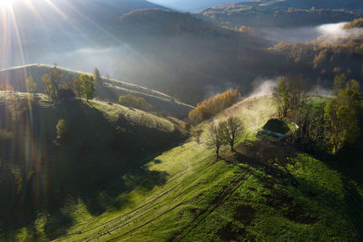 Aerial view of autumn countryside farm, with abandoned wooden houses. transylvania, romania