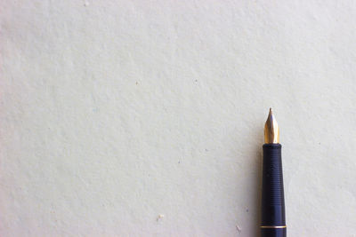 High angle view of pencils on white surface