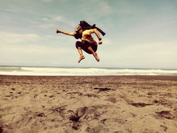 Man jumping on beach