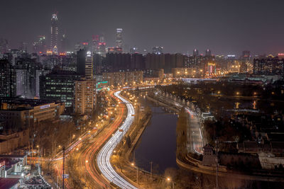 High angle view of illuminated cityscape at night