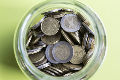 High angle view of coins in container