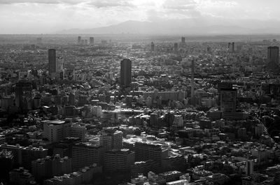 High angle view of modern buildings in city against sky