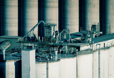 Factory against cloudy sky