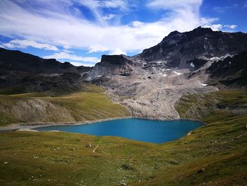 Scenic view of lake and mountains against sky