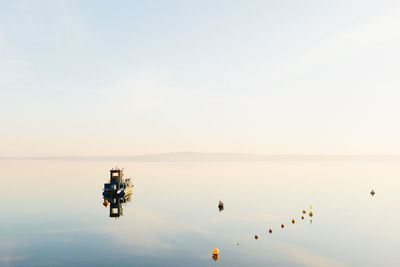 View of boat in sea against sky