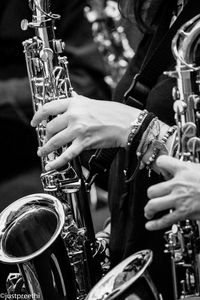 Midsection of man playing music concert