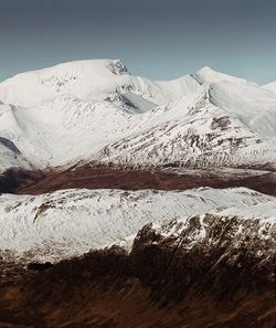 Scenic view of snow covered mountains