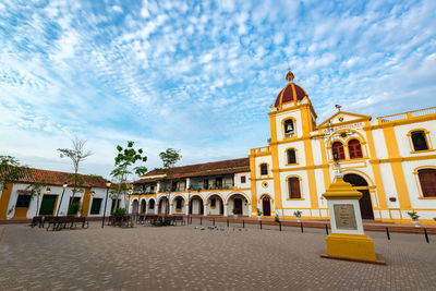 Low angle view of cathedral against cloudy sky