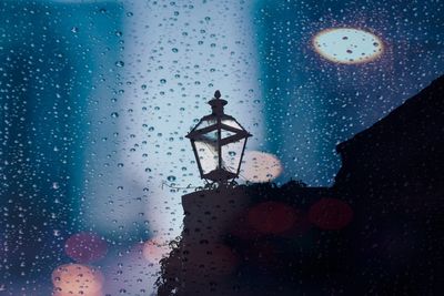 Close-up of wet glass window in rainy season