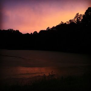 Scenic view of lake at sunset