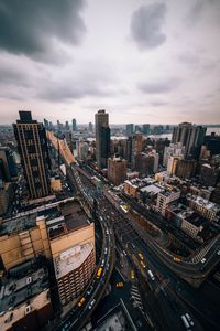 High angle view of buildings in city against sky