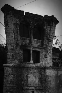 Low angle view of old building against sky