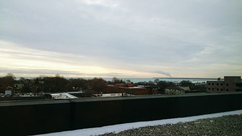 Buildings against cloudy sky