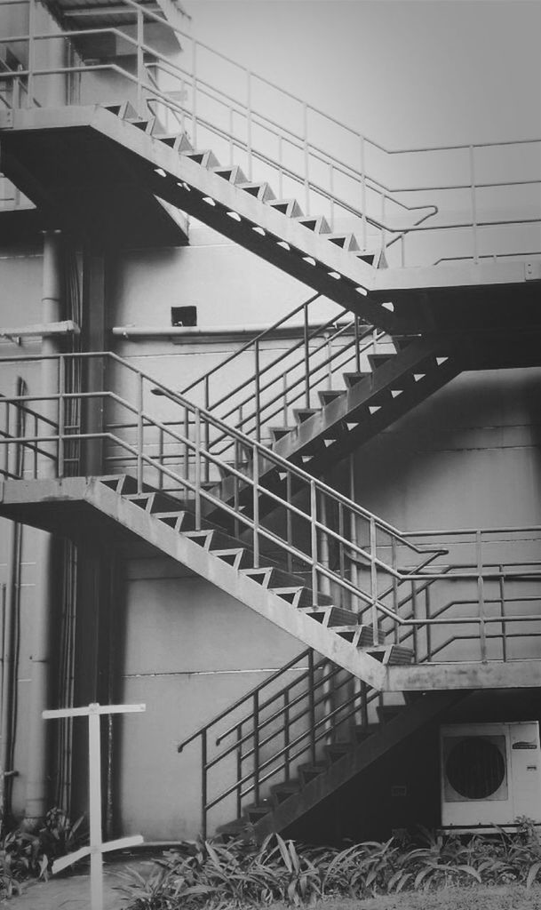architecture, built structure, building exterior, low angle view, railing, connection, staircase, building, steps, steps and staircases, clear sky, day, bridge - man made structure, cable, residential building, no people, outdoors, metal, sky, residential structure