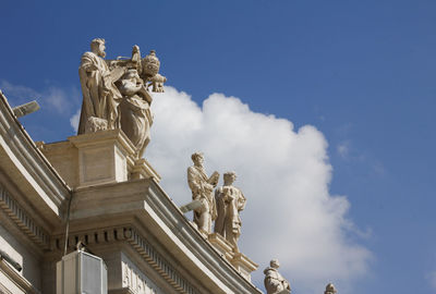 Low angle view of statue against cloudy sky