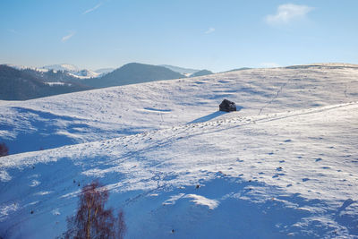 Sun over the winter mountains with snow, cindrel mountains, paltinis, romania