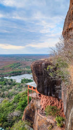 Scenic view of landscape against cloudy sky
