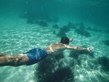 Man swimming in water