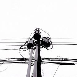 Low angle view of electricity pylon