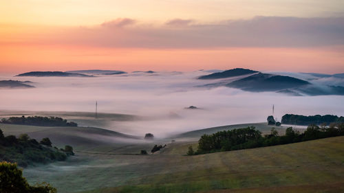 Scenic view of landscape against sky during sunset