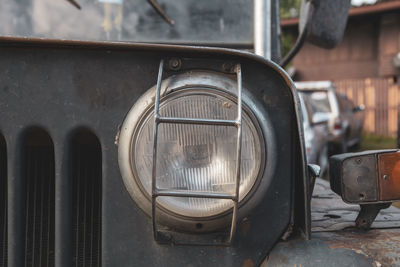 Close-up of old abandoned car