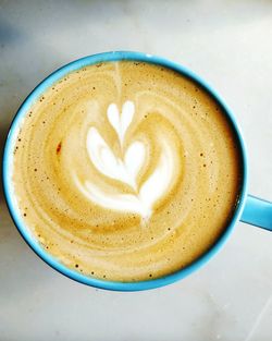 Close-up of cappuccino on table