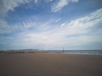 Scenic view of beach against sky