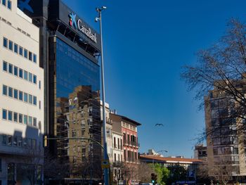 Low angle view of buildings against blue sky