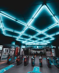 Low angle view of illuminated subway station
