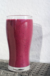 Close-up of beer glass on table