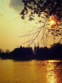 Scenic view of river at sunset