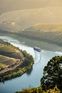 Scenic view of agricultural landscape and river