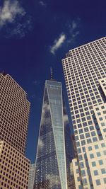 Low angle view of skyscrapers against sky