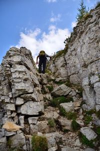 Low angle view of rocks on rock against sky