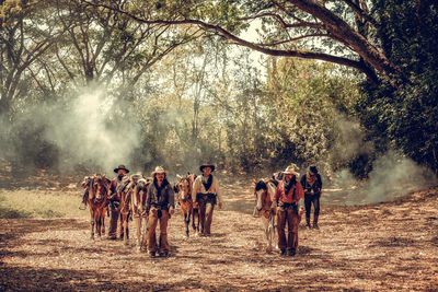 Group of people walking on field