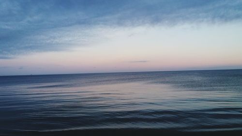 Scenic view of sea against sky at sunset