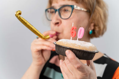 Midsection of woman holding ice cream