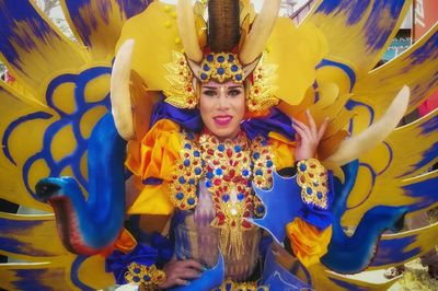 Portrait of young woman wearing costume during carnival