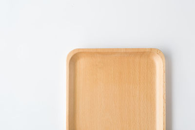 Directly above shot of empty table against white background