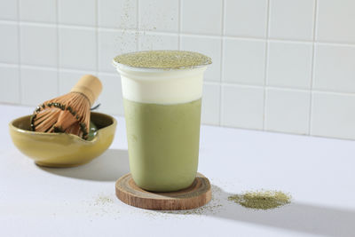 Dalgona matcha green tea milkshake on white table