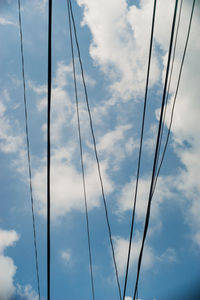 Low angle view of cables against sky