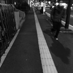 People walking on road in city