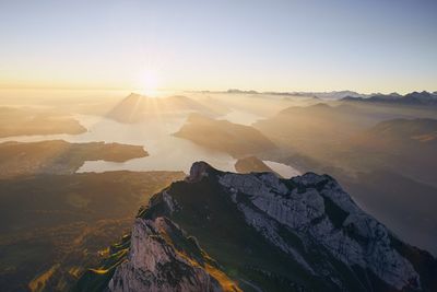 Scenic view of mountains against sky during sunset